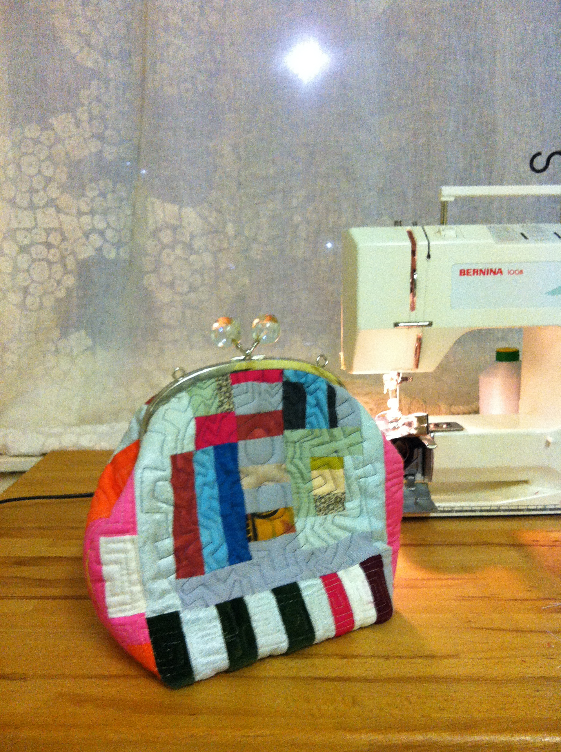 multicoloured improvisational patchwork pieced and quilted purse in mixed fibres, handmade from reloved cloth by Maggie Winnall- Sewin Studio